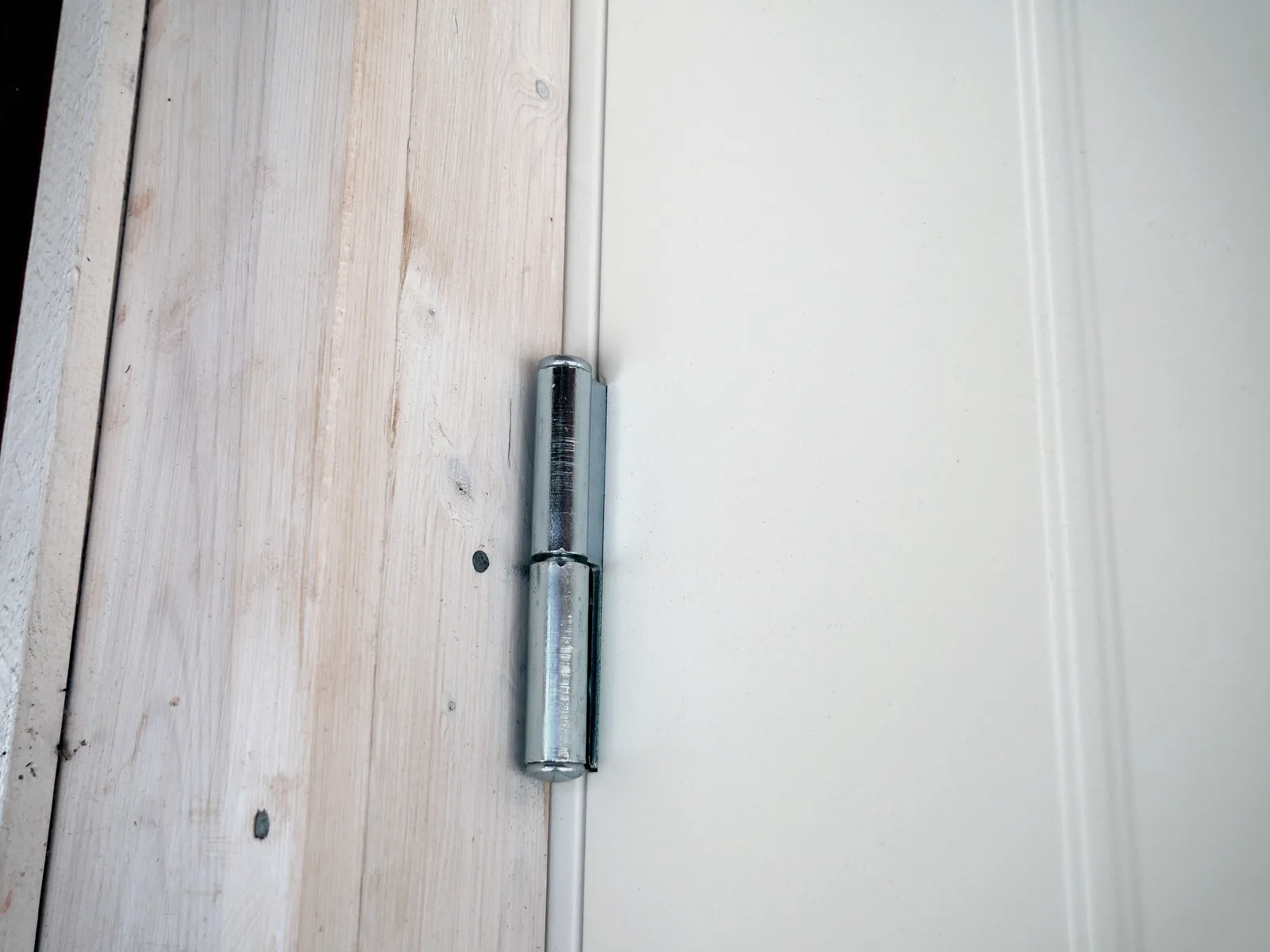 Metal hinge installed on furniture