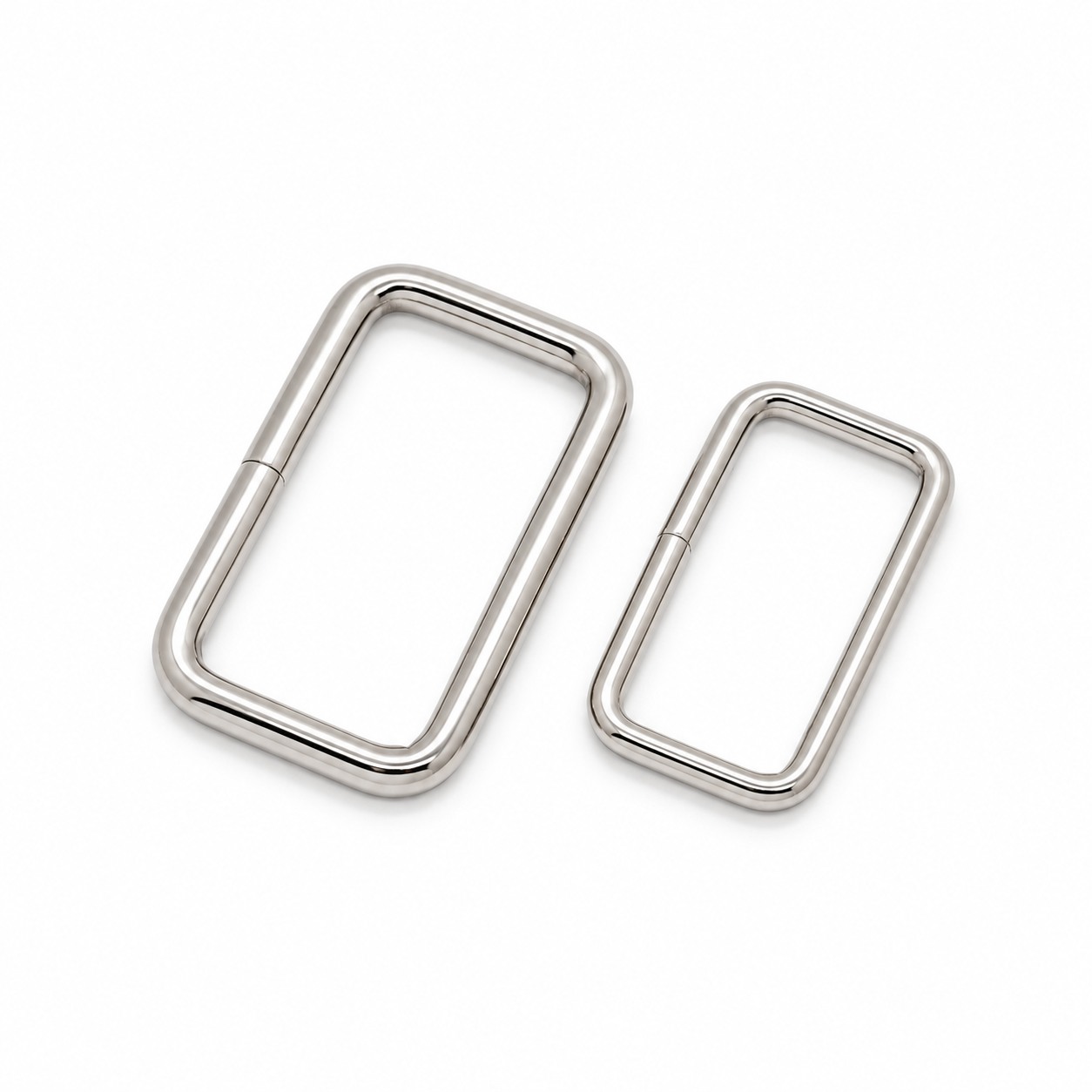 Polished rectangular metal rings in two sizes for webbing straps
