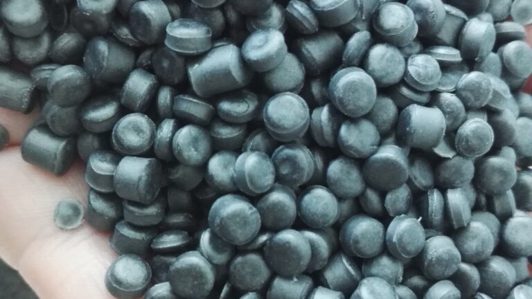 Close-up of polymer pellets used in plastics manufacturing