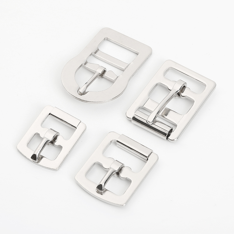 Four styles of flat metal roller pin buckles for straps