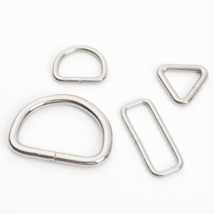 Four styles of metal connecting rings for webbing and strap hardware