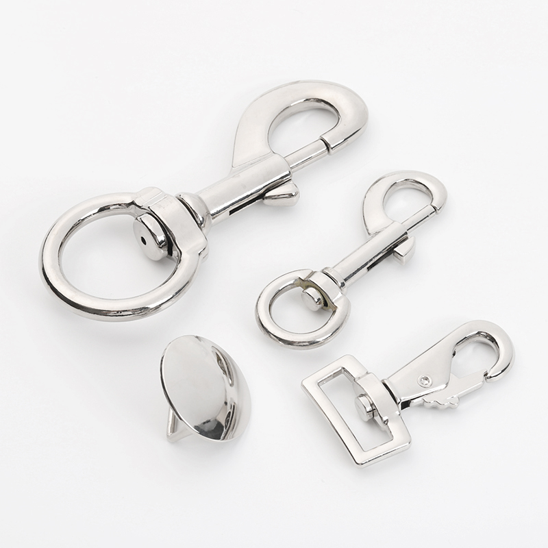 Four styles of silver-tone swivel snap hooks and round pin-back hardware